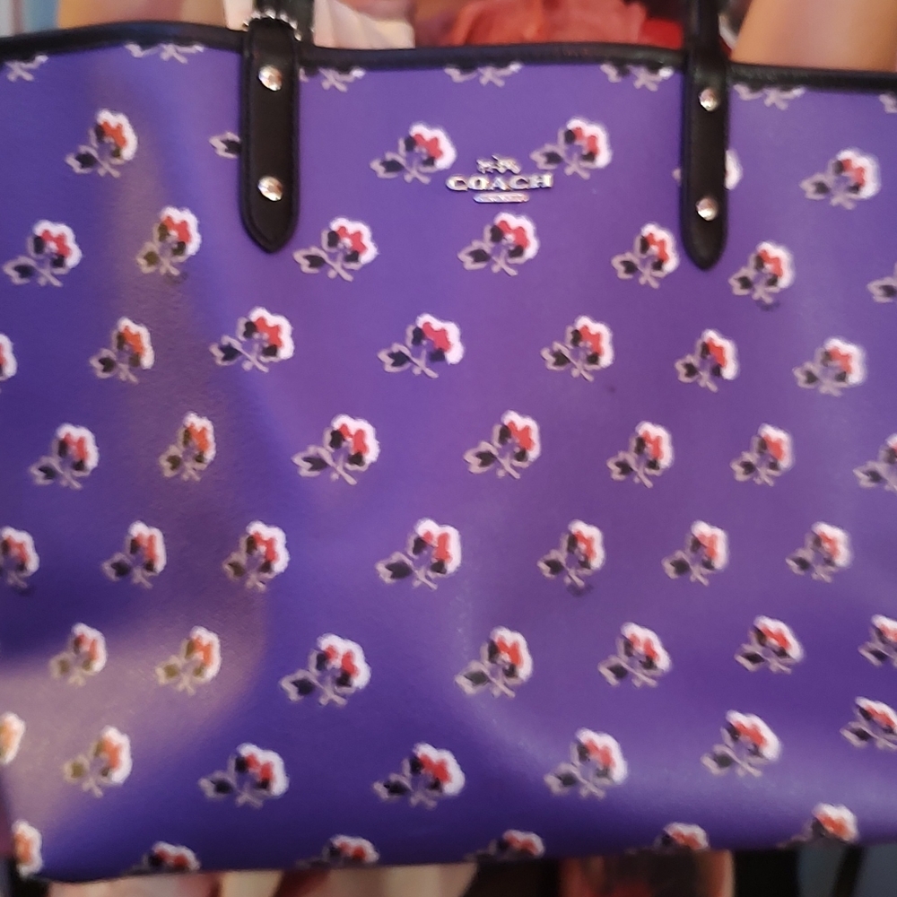 Gently used Coach city tote in rare purple pattern. Is reversible.